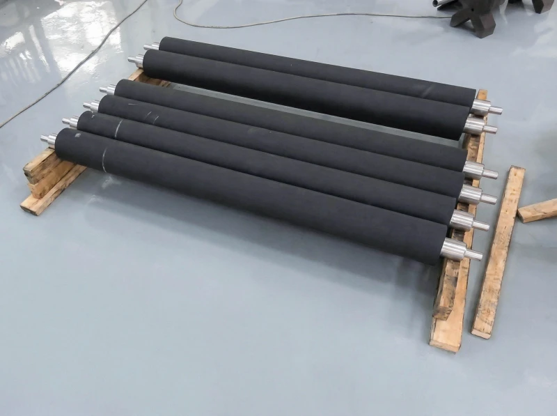 black industrial rubber rollers with steel shafts