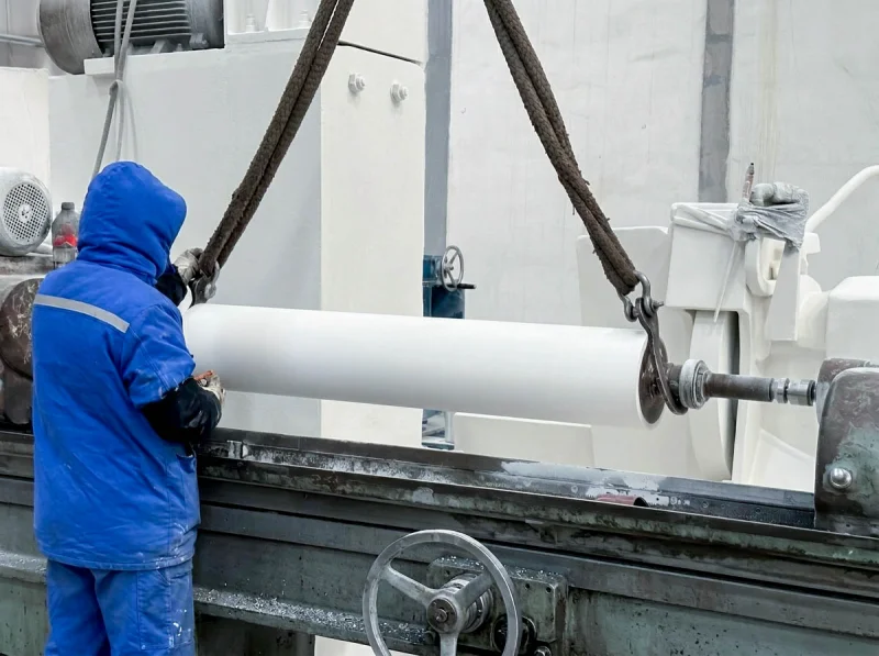 White industrial roller in workshop