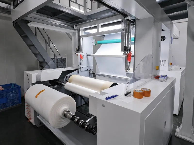 Plastic film running through an industrial film processing line