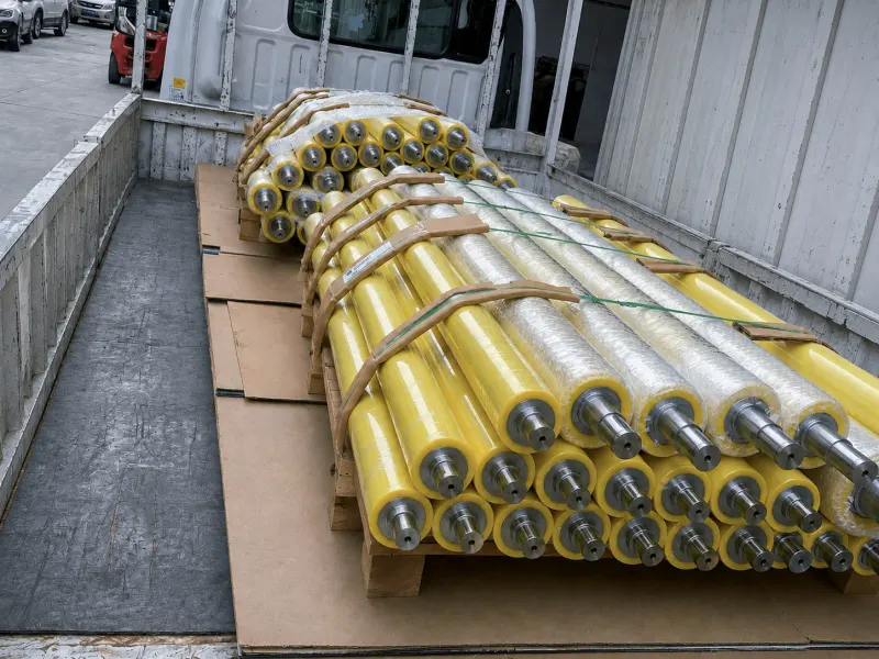 Yellow polyurethane rollers packed on a truck for shipment