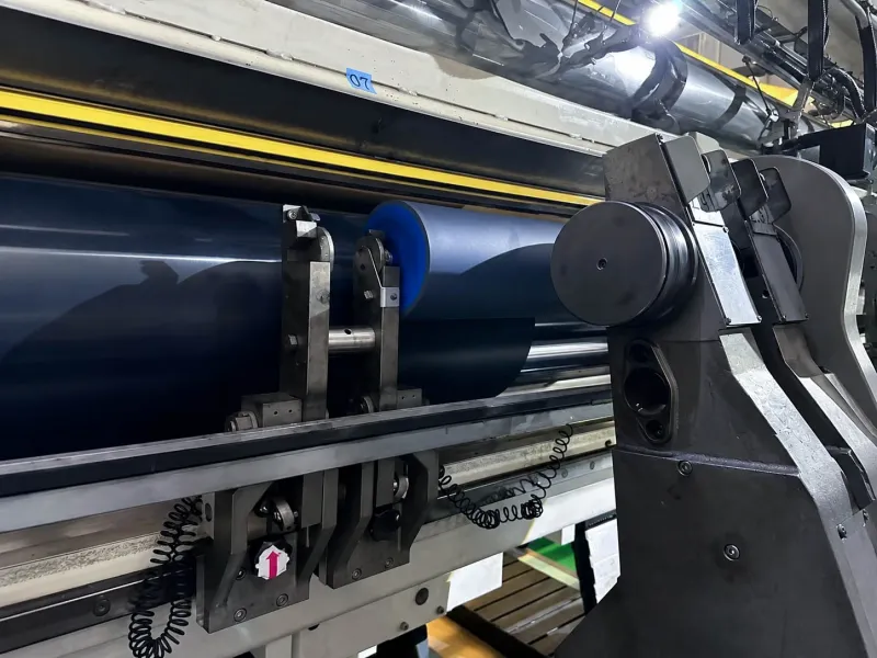 BOPET film running through a high-speed slitting and rewinding roller section