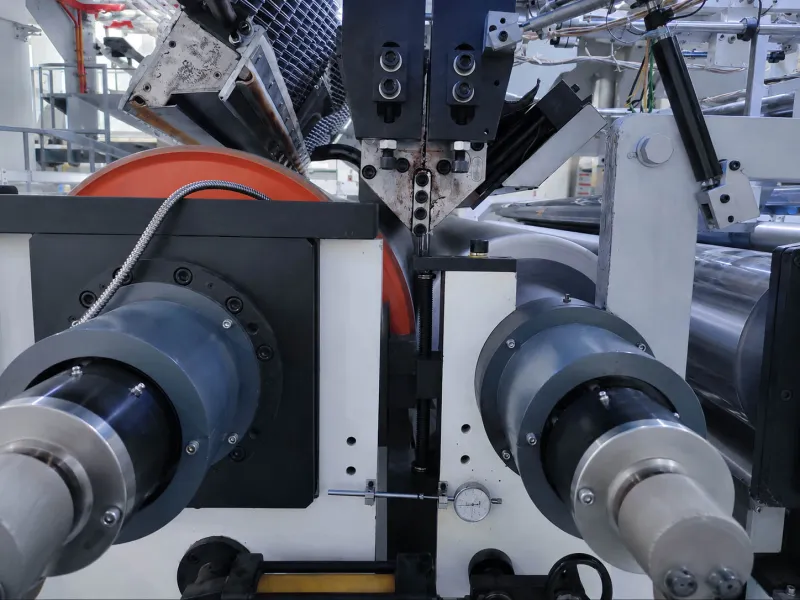 CPE matte film contact section with rollers and machine components