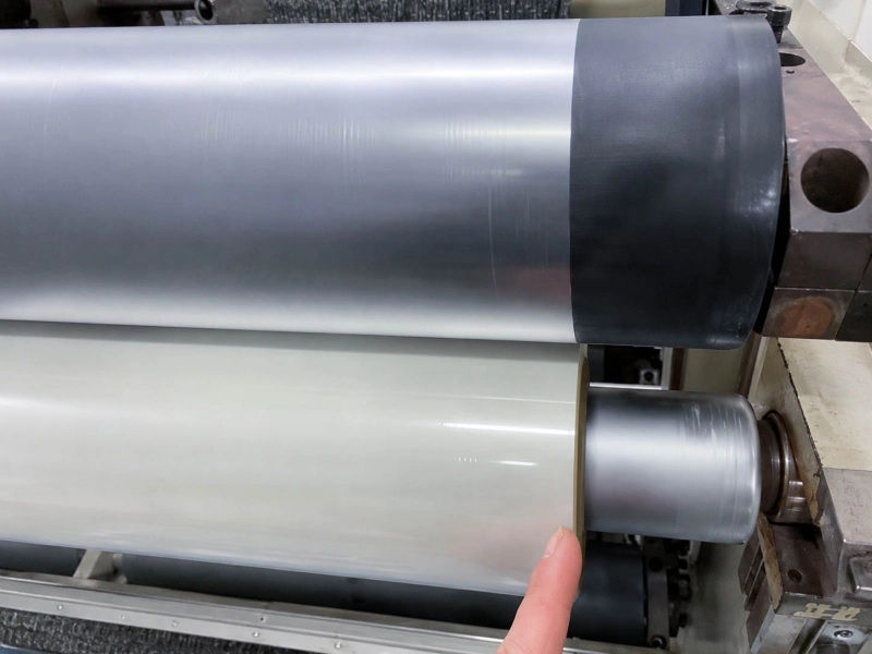 Pre-coated film roller contact point with visible edge and surface marks