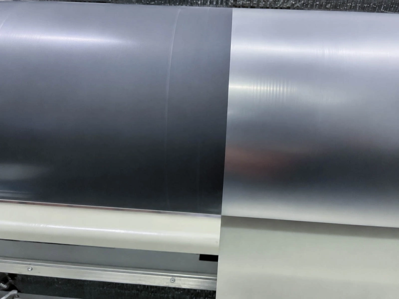 Pre-coated film roller surface with visible line marks during production