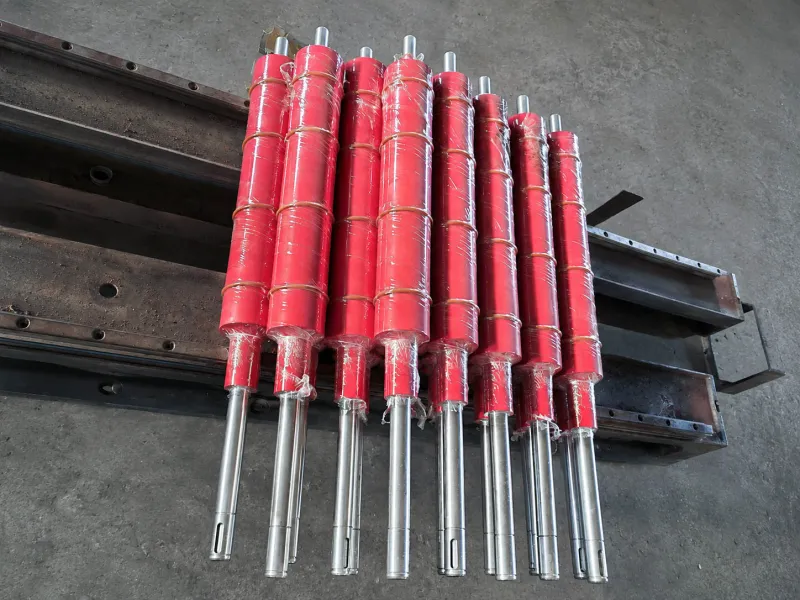 Red NBR rubber rollers wrapped for protection with steel shafts